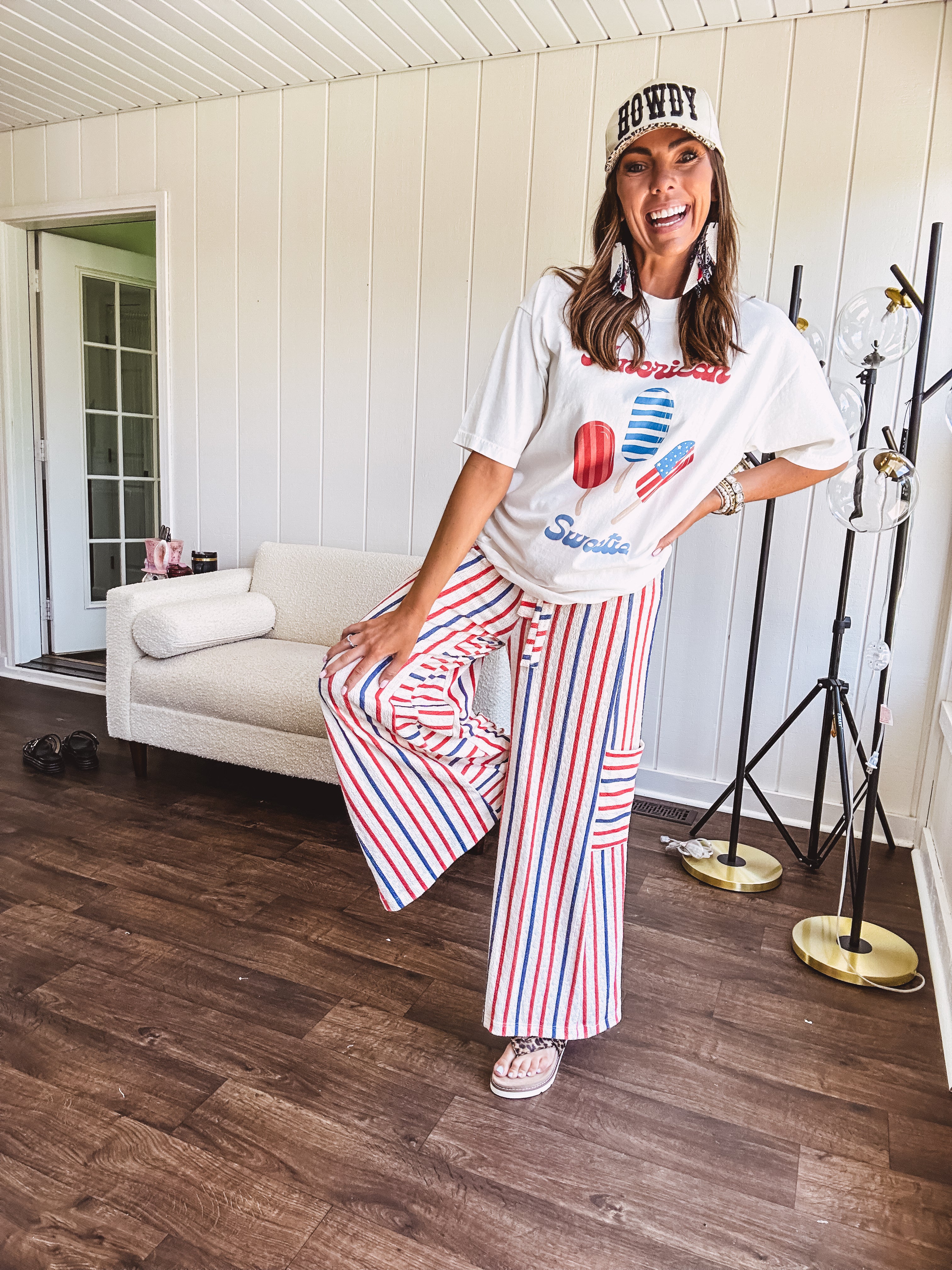Thin, lightweight textured wide leg pant with red, blue and cream stripes with elastic drawstring waist and side pockets.
