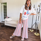 Thin, lightweight textured wide leg pant with red, blue and cream stripes with elastic drawstring waist and side pockets.
