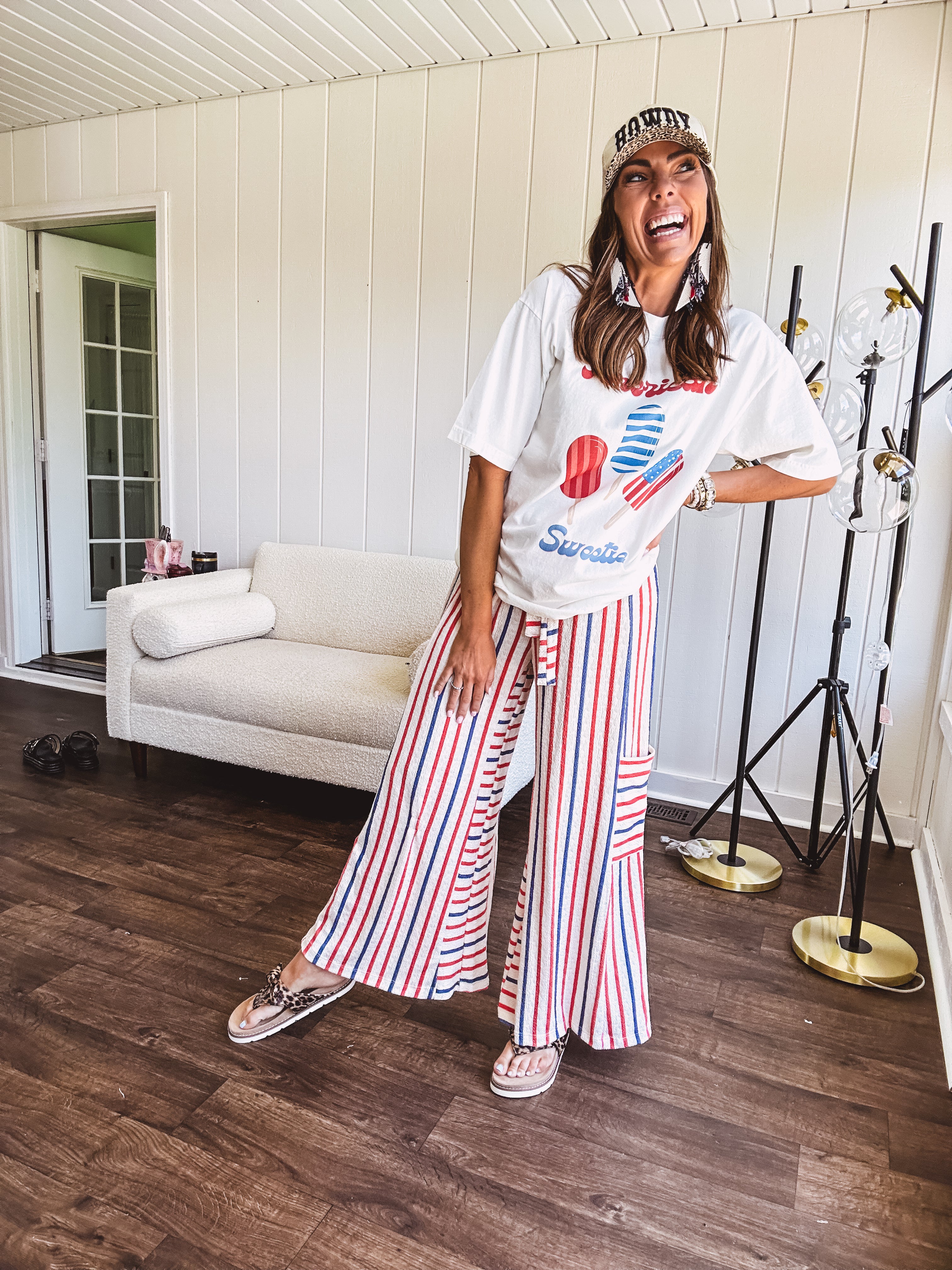 Thin, lightweight textured wide leg pant with red, blue and cream stripes with elastic drawstring waist and side pockets.