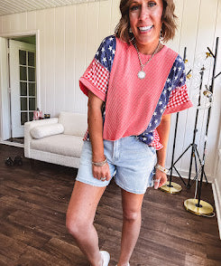 Washed red urban ribbed tee with red and white gingham and navy stars and stripes patchwork down the sides and shoulders.