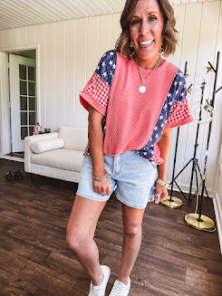 Washed red urban ribbed tee with red and white gingham and navy stars and stripes patchwork down the sides and shoulders.