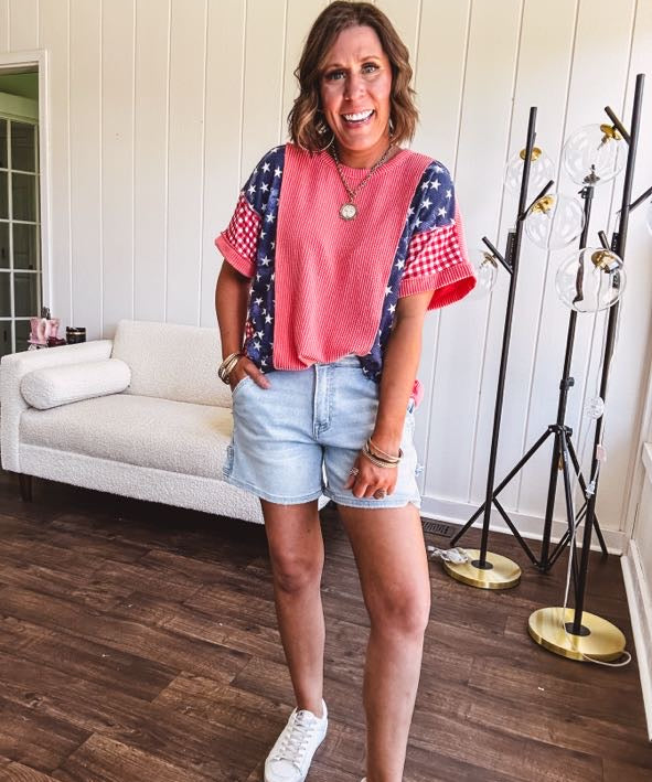 Washed red urban ribbed tee with red and white gingham and navy stars and stripes patchwork down the sides and shoulders.