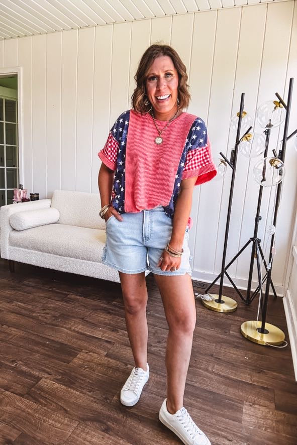 Washed red urban ribbed tee with red and white gingham and navy stars and stripes patchwork down the sides and shoulders.