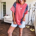 Washed red urban ribbed tee with red and white gingham and navy stars and stripes patchwork down the sides and shoulders.