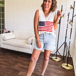 Thin, ivory ribbed textured V neck tank with American flag crochet applique on the front.