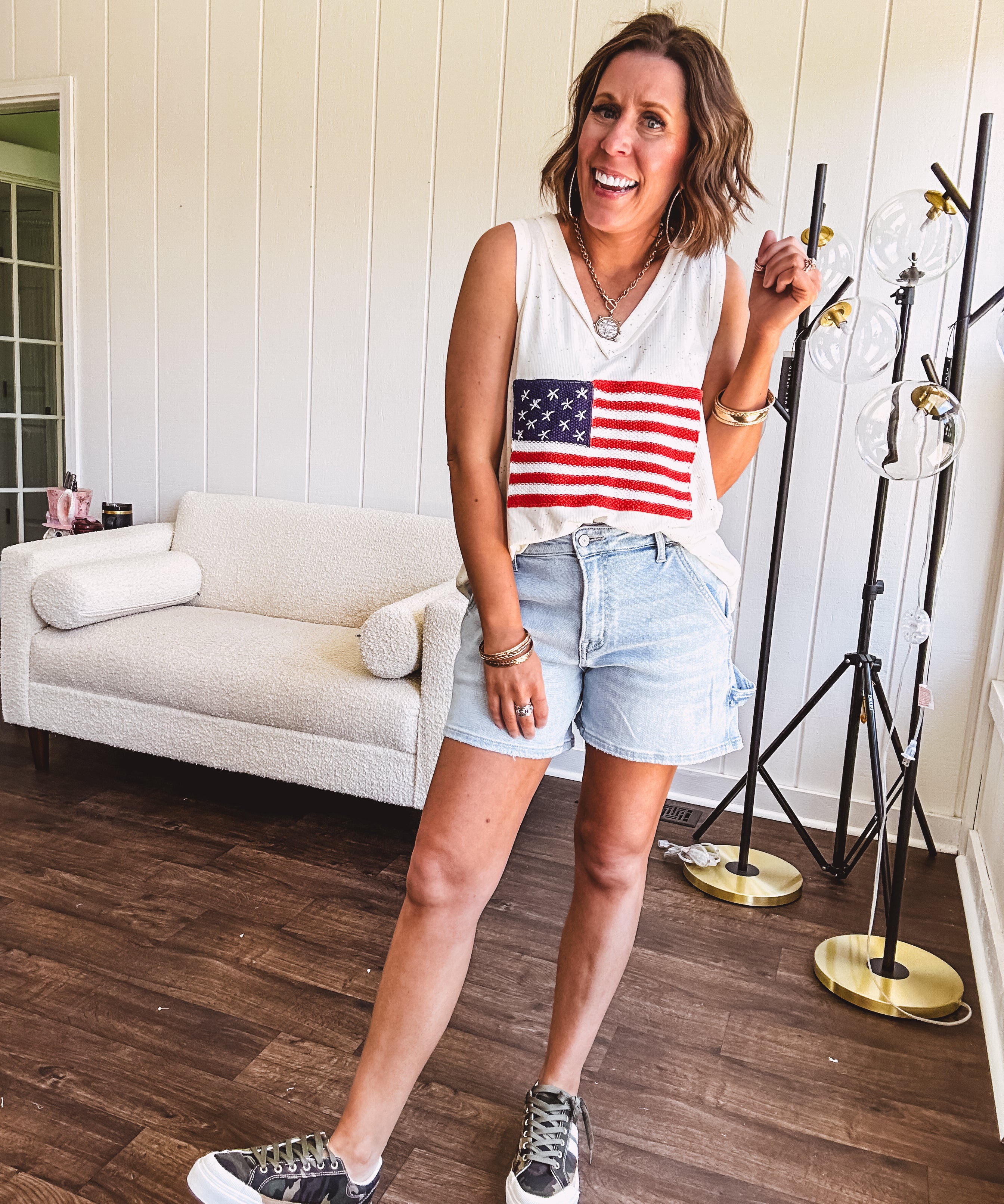 Thin, ivory ribbed textured V neck tank with American flag crochet applique on the front.
