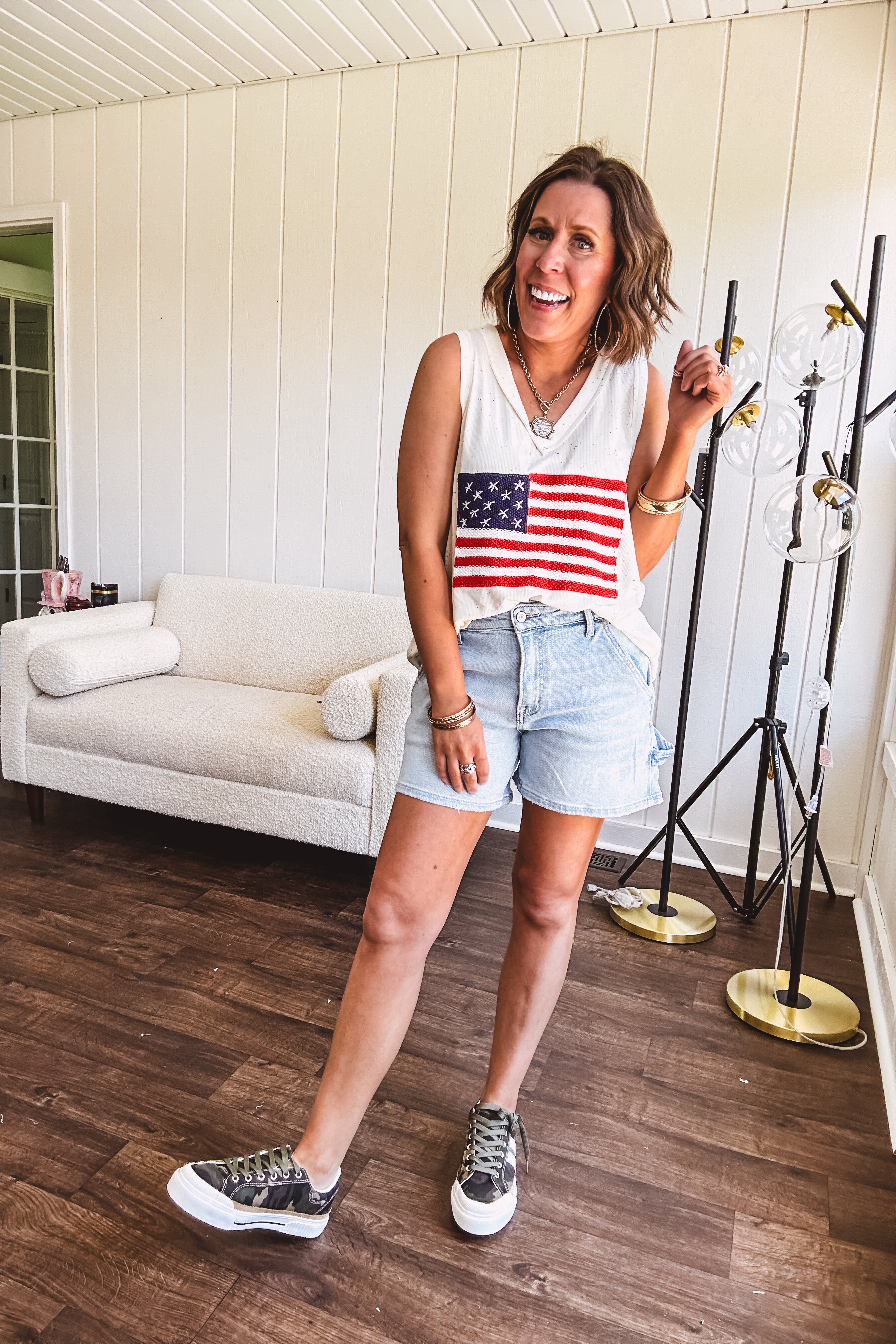 Thin, ivory ribbed textured V neck tank with American flag crochet applique on the front.