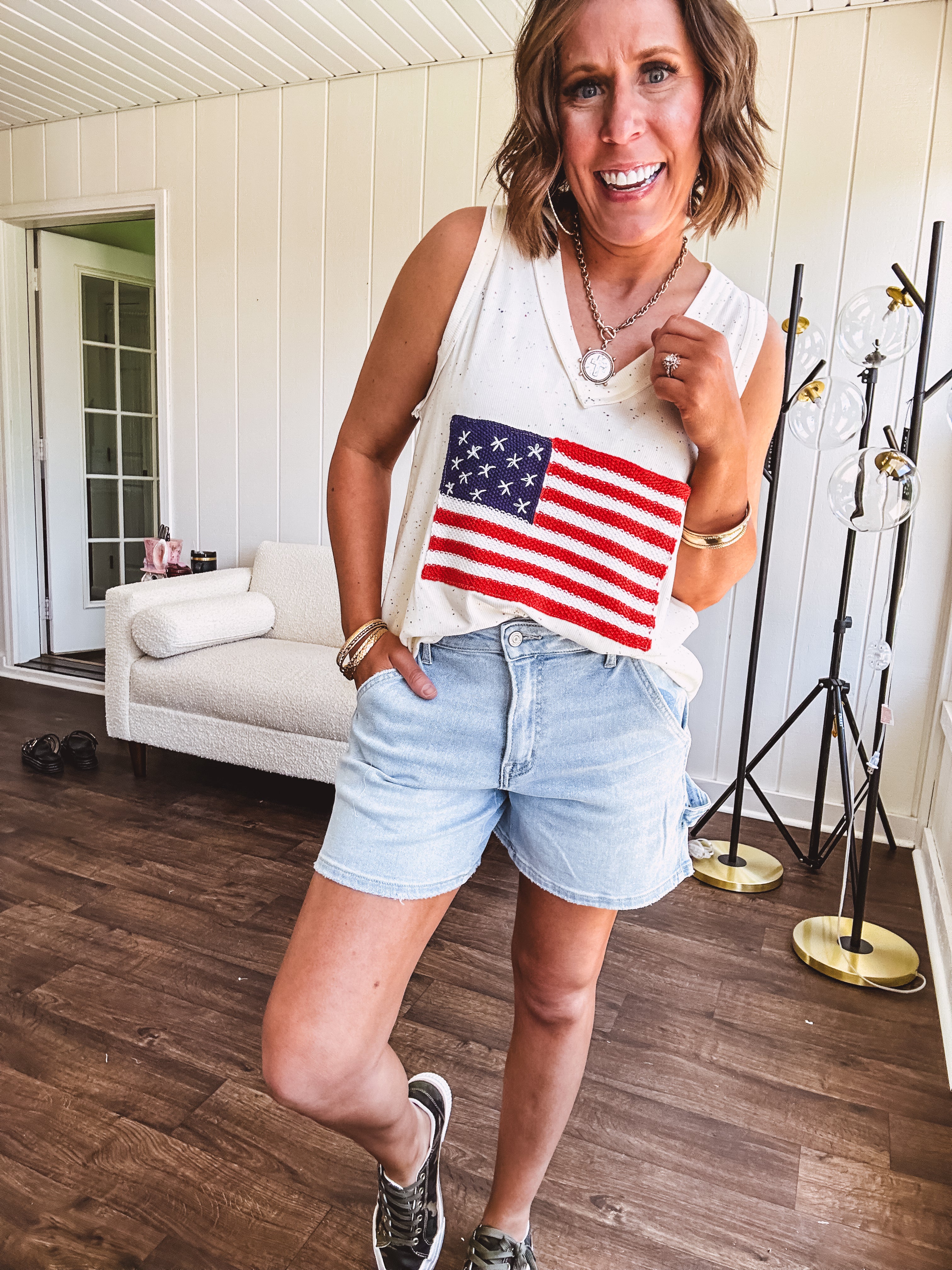 Thin, ivory ribbed textured V neck tank with American flag crochet applique on the front.