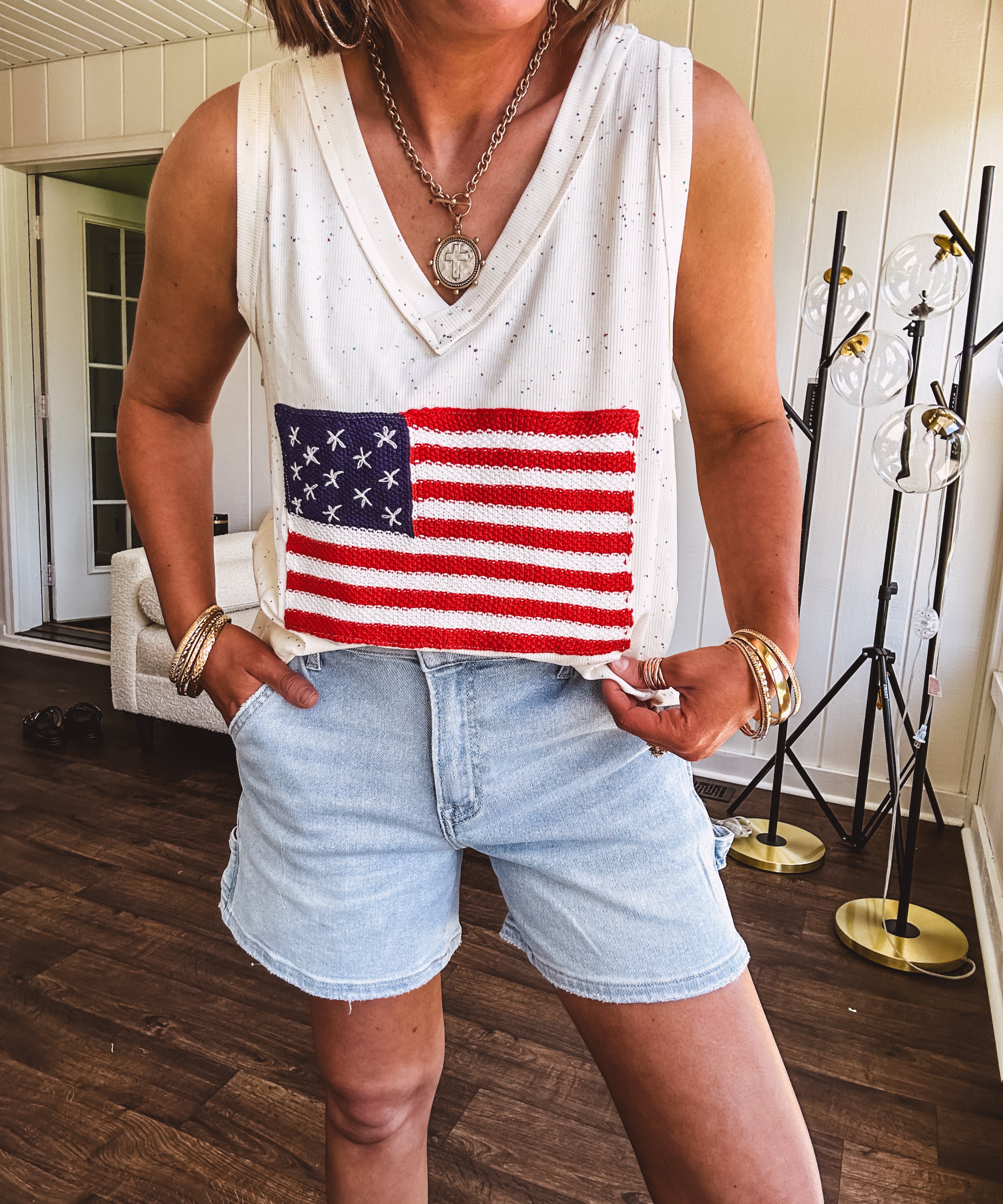 Thin, ivory ribbed textured V neck tank with American flag crochet applique on the front.