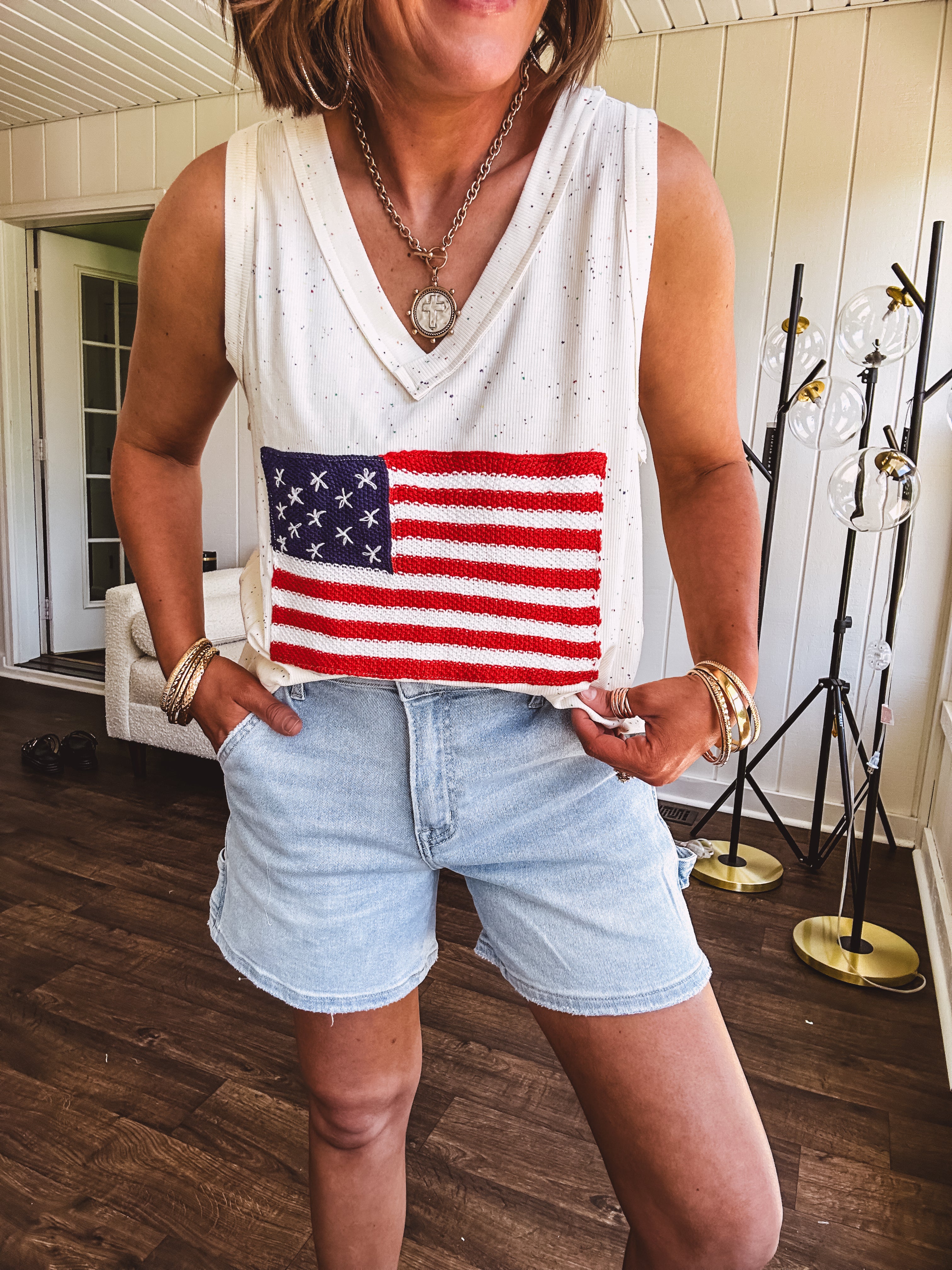 Thin, ivory ribbed textured V neck tank with American flag crochet applique on the front.