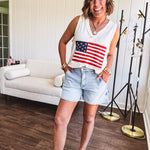 Thin, ivory ribbed textured V neck tank with American flag crochet applique on the front.