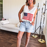 Thin, ivory ribbed textured V neck tank with American flag crochet applique on the front.