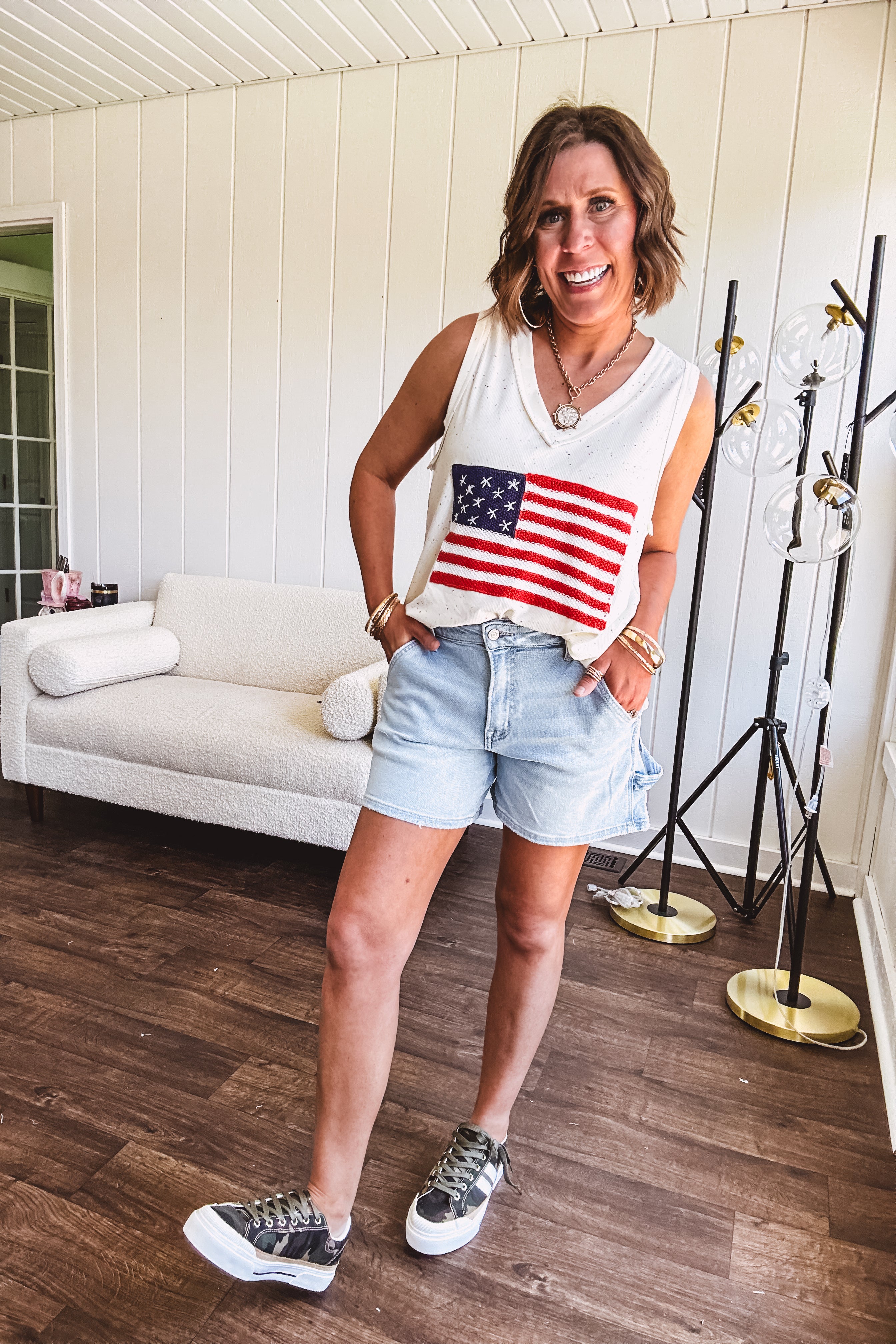 Thin, ivory ribbed textured V neck tank with American flag crochet applique on the front.