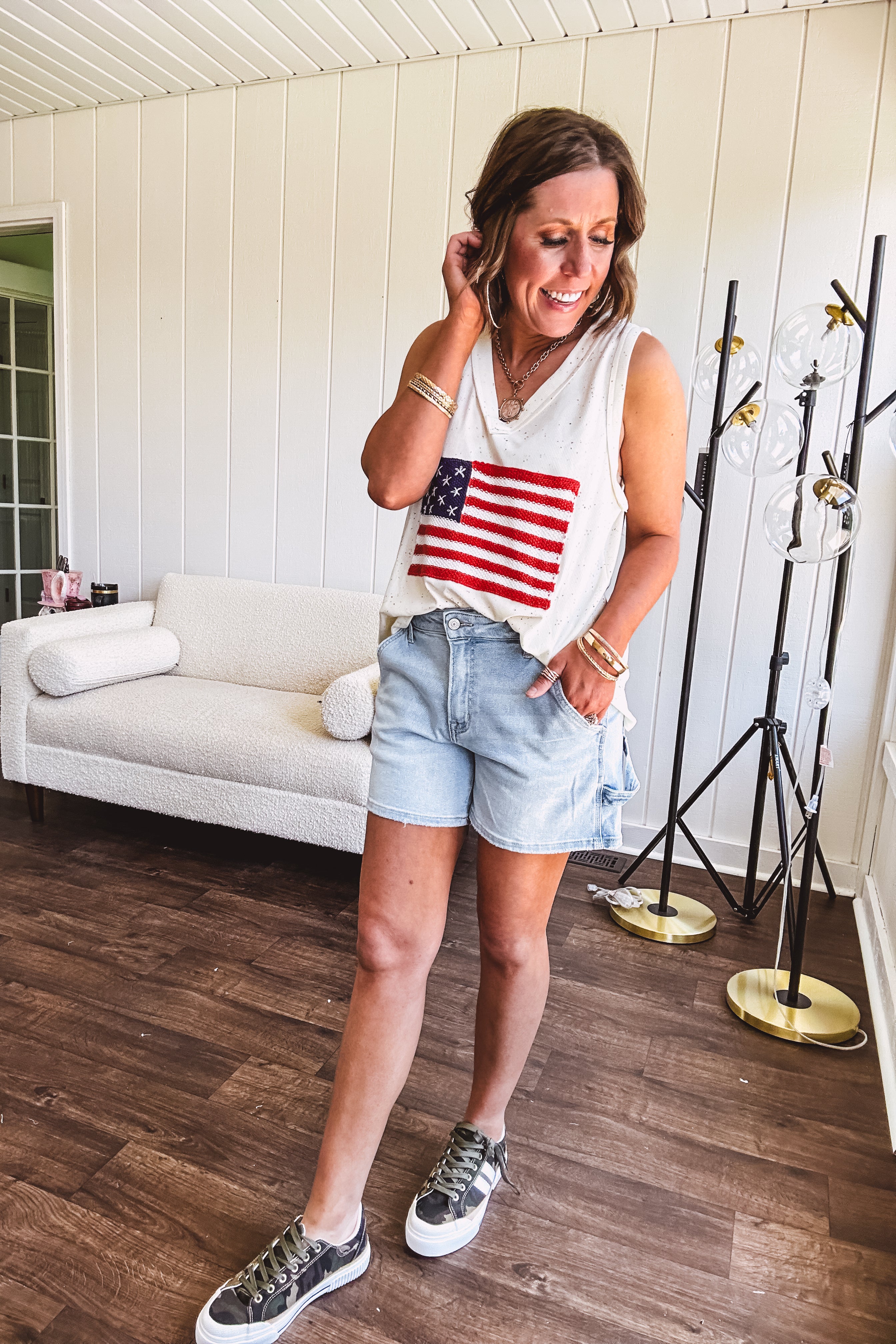 Thin, ivory ribbed textured V neck tank with American flag crochet applique on the front.