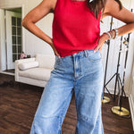 Soft, lightweight knit tank with wide straps and crochet detail at the trim.