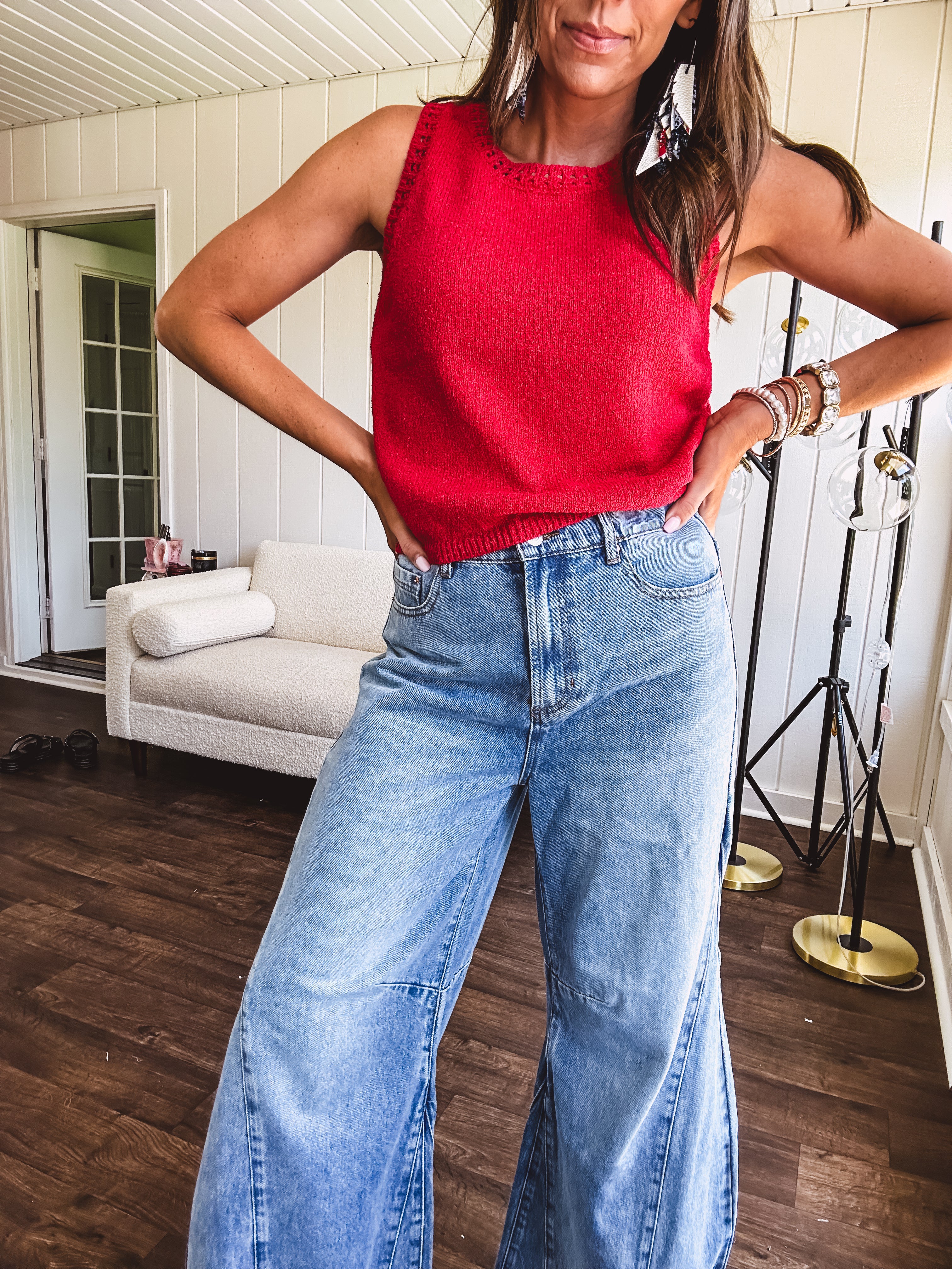 Soft, lightweight knit tank with wide straps and crochet detail at the trim.