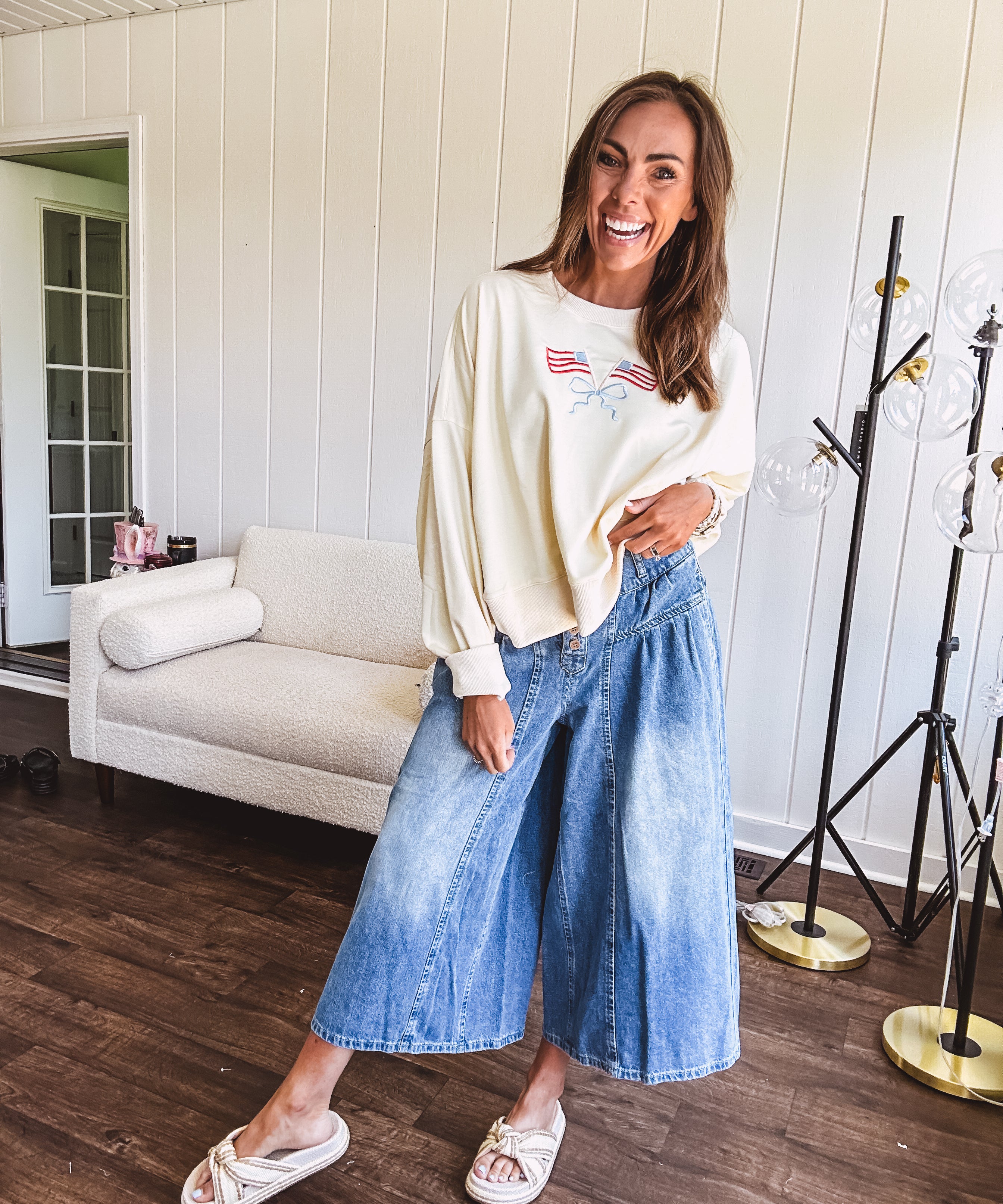 Light wash wide leg denim culottes with pleating at the top, button fly and pockets.