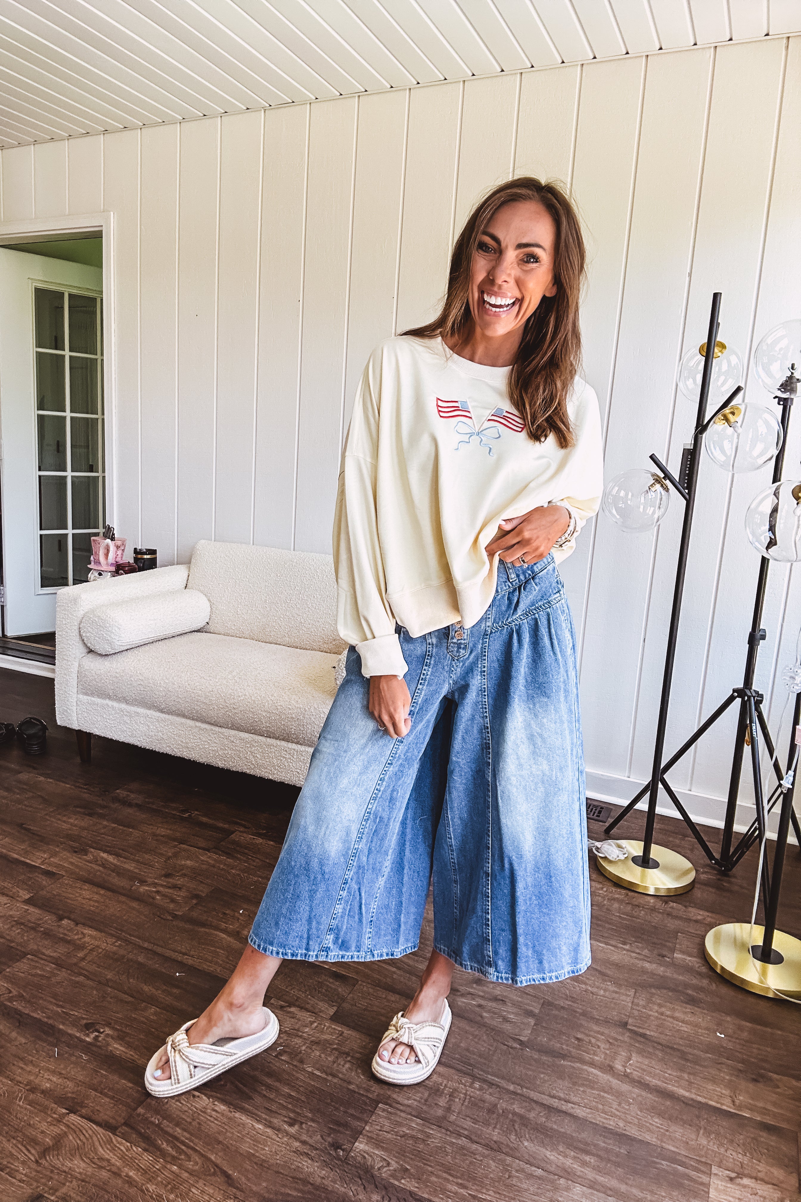 Light wash wide leg denim culottes with pleating at the top, button fly and pockets.