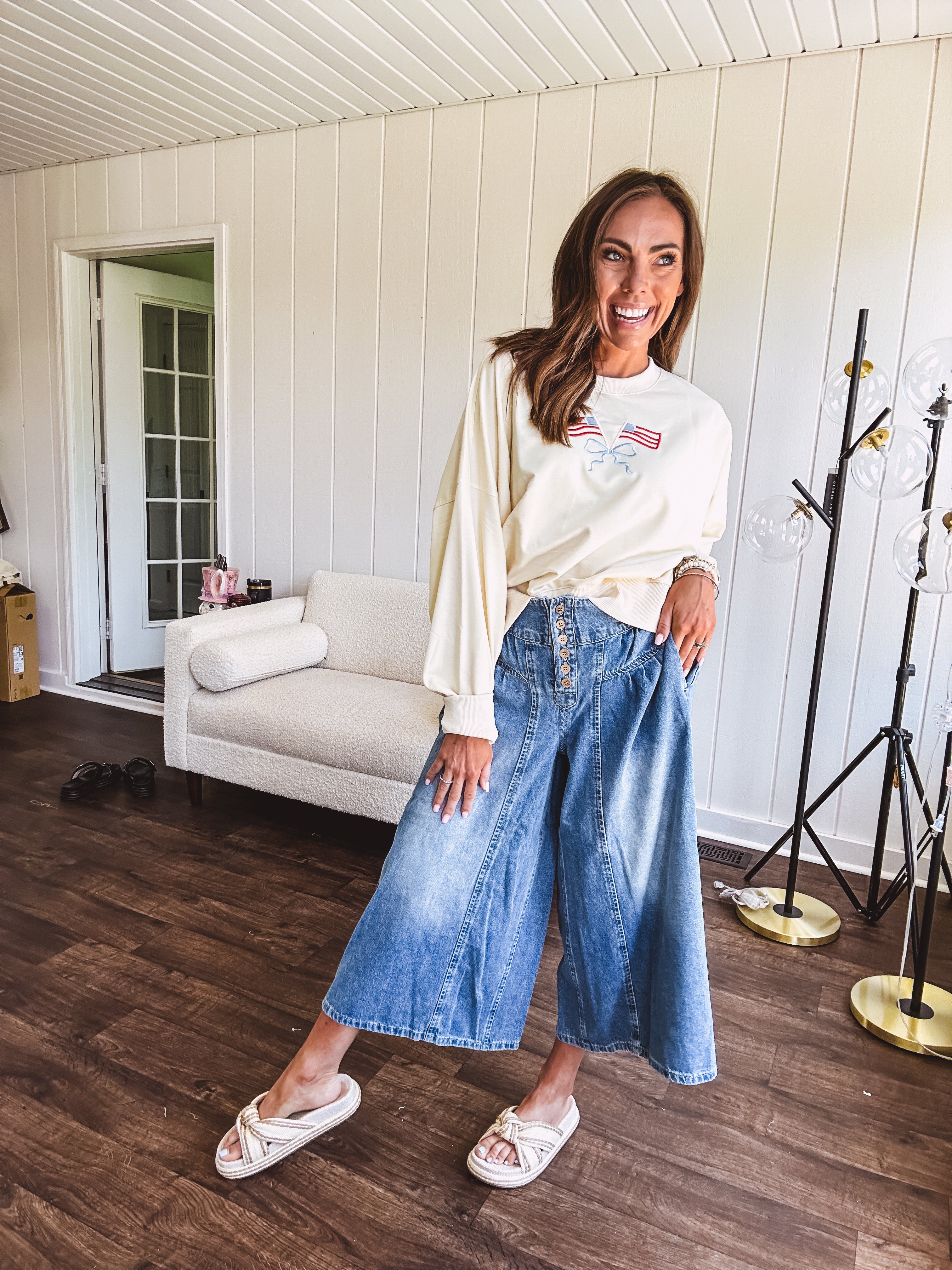 Light wash wide leg denim culottes with pleating at the top, button fly and pockets.
