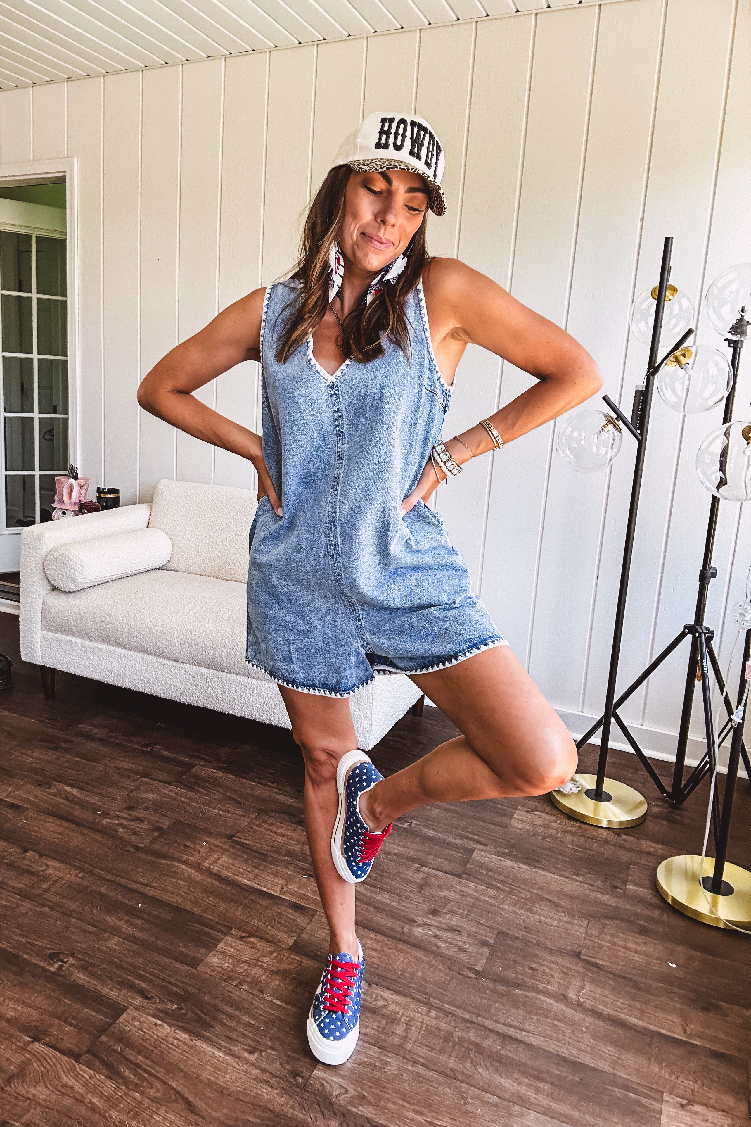 Medium mineral wash denim jumper with V neck, zipper back and white trim throughout. Has pockets.