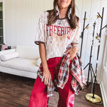 Floral lace sheer tee with brown trim throughout and red "FREEBIRD" and cream eagle graphic.