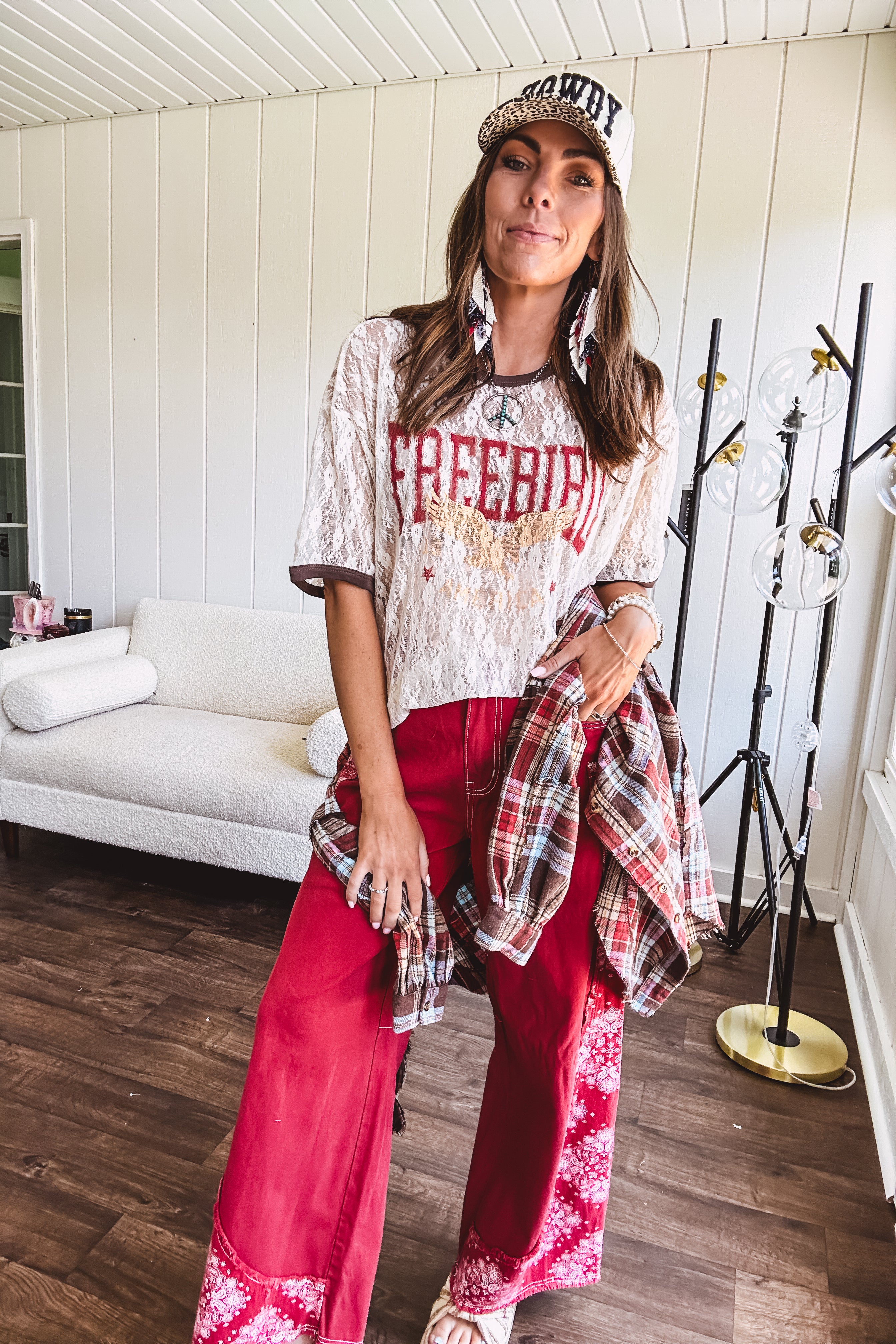 Floral lace sheer tee with brown trim throughout and red "FREEBIRD" and cream eagle graphic.