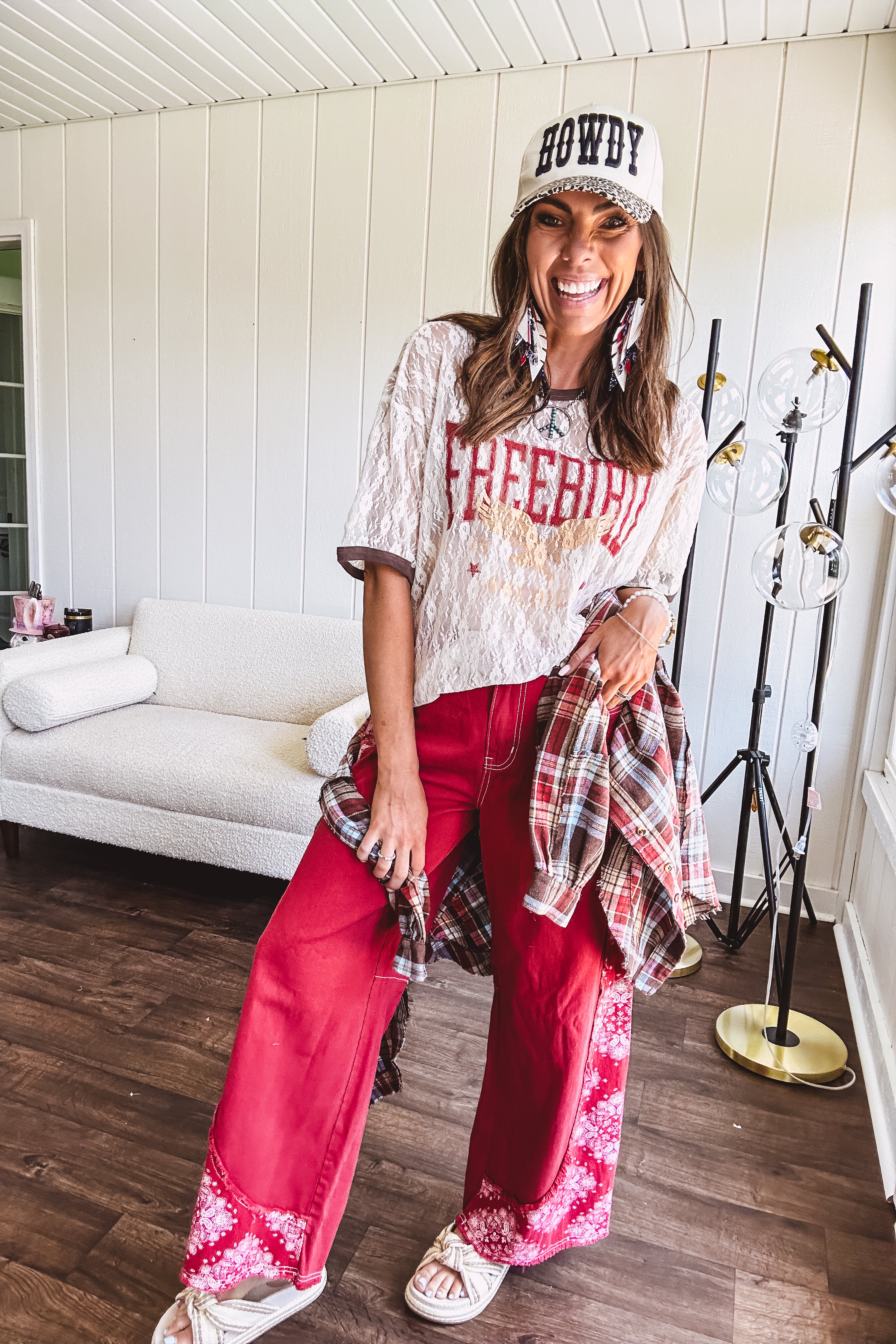 Floral lace sheer tee with brown trim throughout and red "FREEBIRD" and cream eagle graphic.