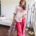 Floral lace sheer tee with brown trim throughout and red "FREEBIRD" and cream eagle graphic.