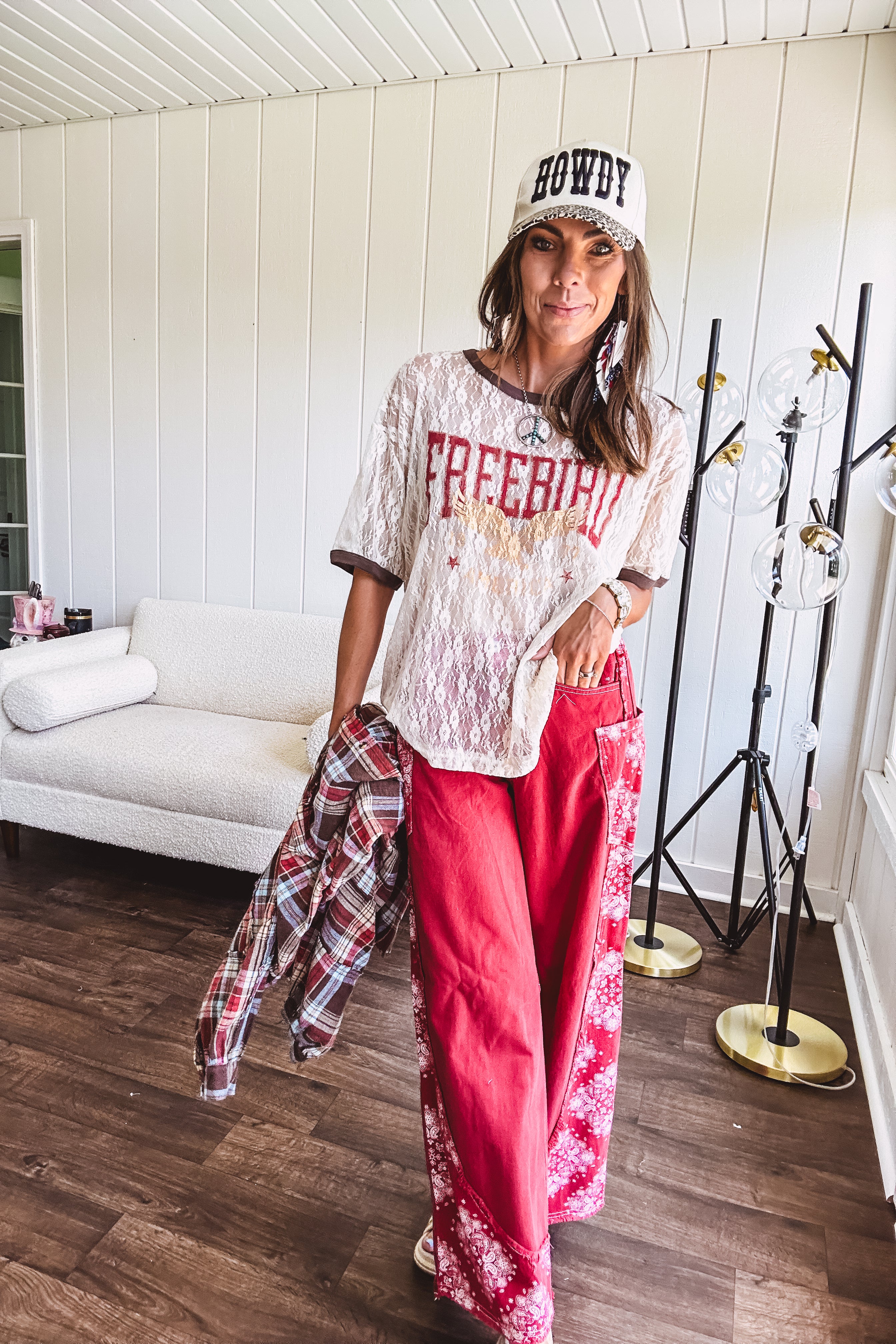 Floral lace sheer tee with brown trim throughout and red "FREEBIRD" and cream eagle graphic.