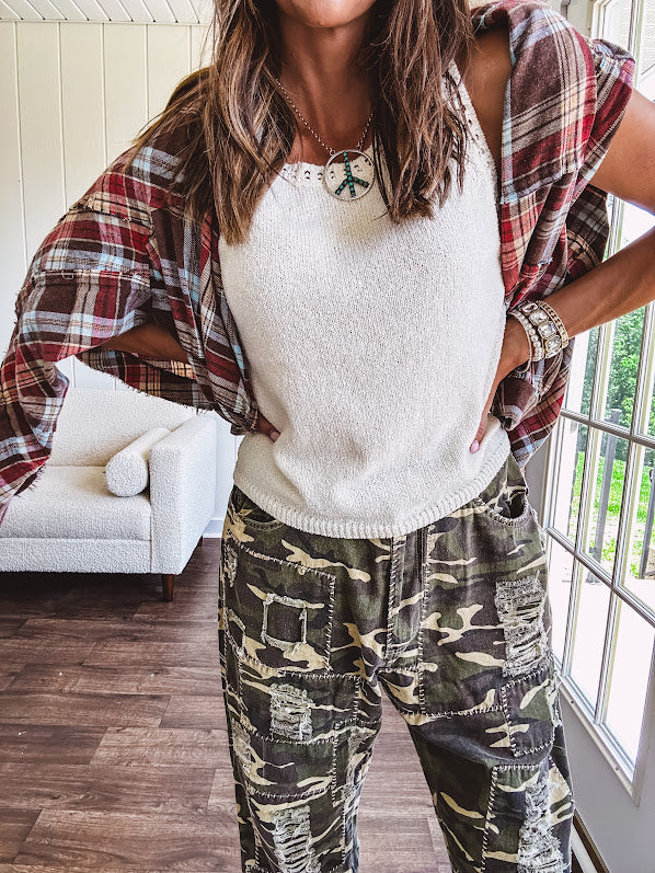 Soft, lightweight knit tank with wide straps and crochet detail at the trim.