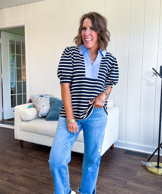Navy and cream striped soft, stretchy top with light blue cotton collar and V neck with cuffed puff sleeves.