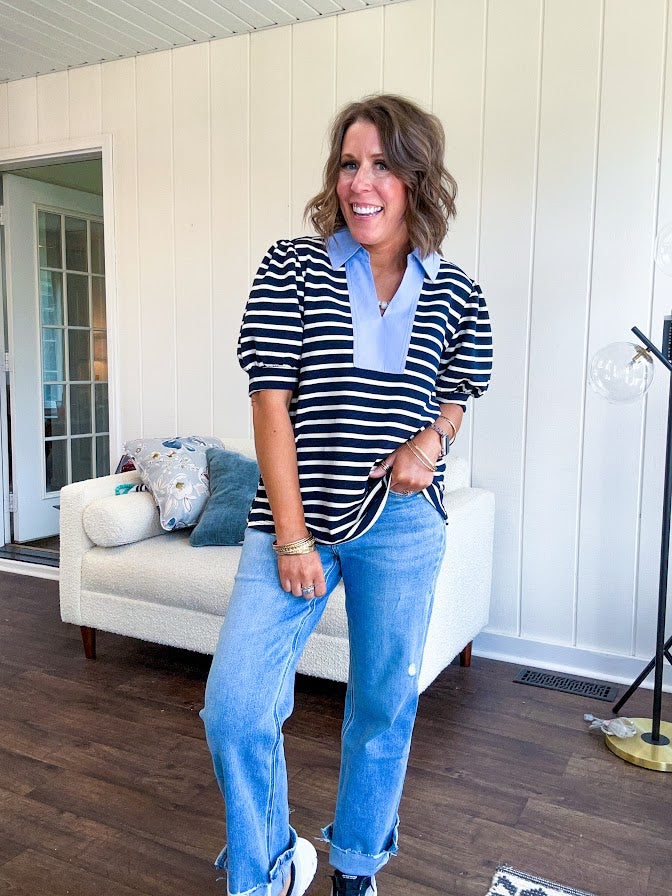 Navy and cream striped soft, stretchy top with light blue cotton collar and V neck with cuffed puff sleeves.