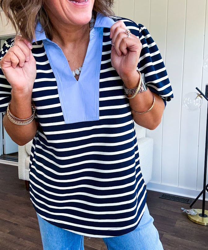 Navy and cream striped soft, stretchy top with light blue cotton collar and V neck with cuffed puff sleeves.