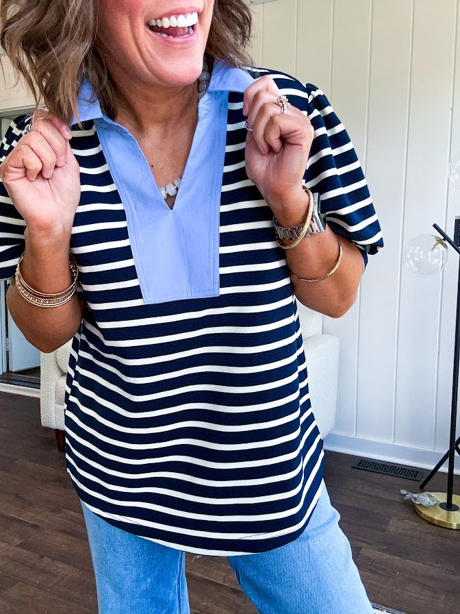 Navy and cream striped soft, stretchy top with light blue cotton collar and V neck with cuffed puff sleeves.