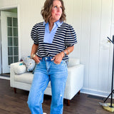 Navy and cream striped soft, stretchy top with light blue cotton collar and V neck with cuffed puff sleeves.
