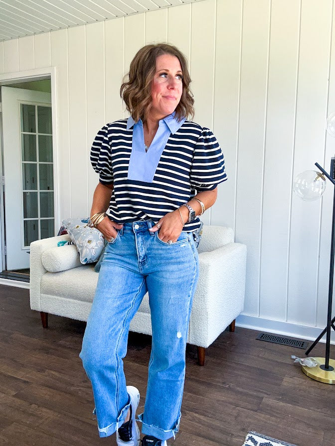 Navy and cream striped soft, stretchy top with light blue cotton collar and V neck with cuffed puff sleeves.