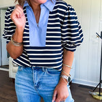 Navy and cream striped soft, stretchy top with light blue cotton collar and V neck with cuffed puff sleeves.