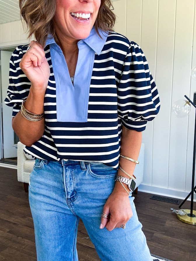Navy and cream striped soft, stretchy top with light blue cotton collar and V neck with cuffed puff sleeves.