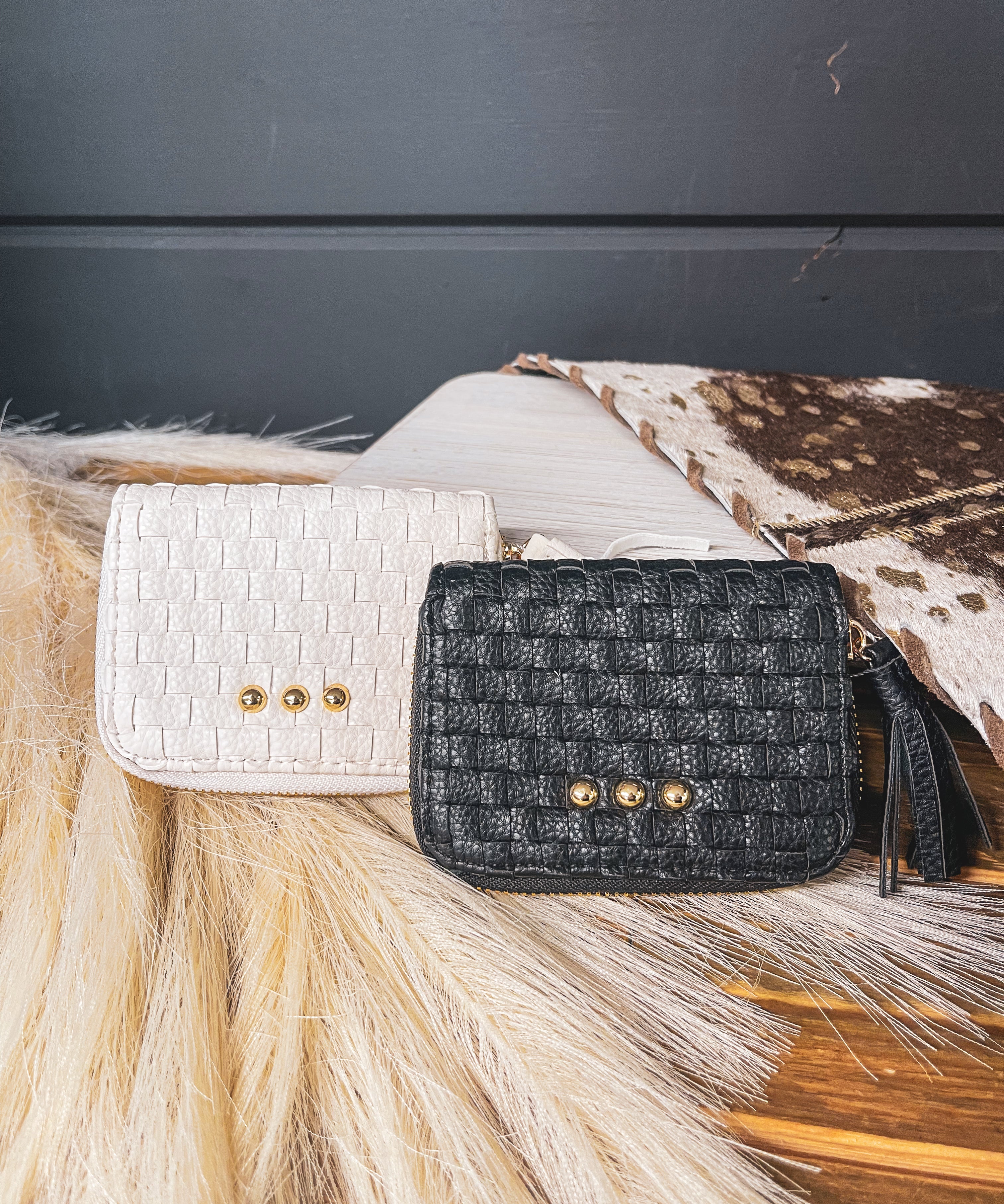 Small leather woven change purse, card holder, wallet in black or white with matching tassel and three gold balls on the front.