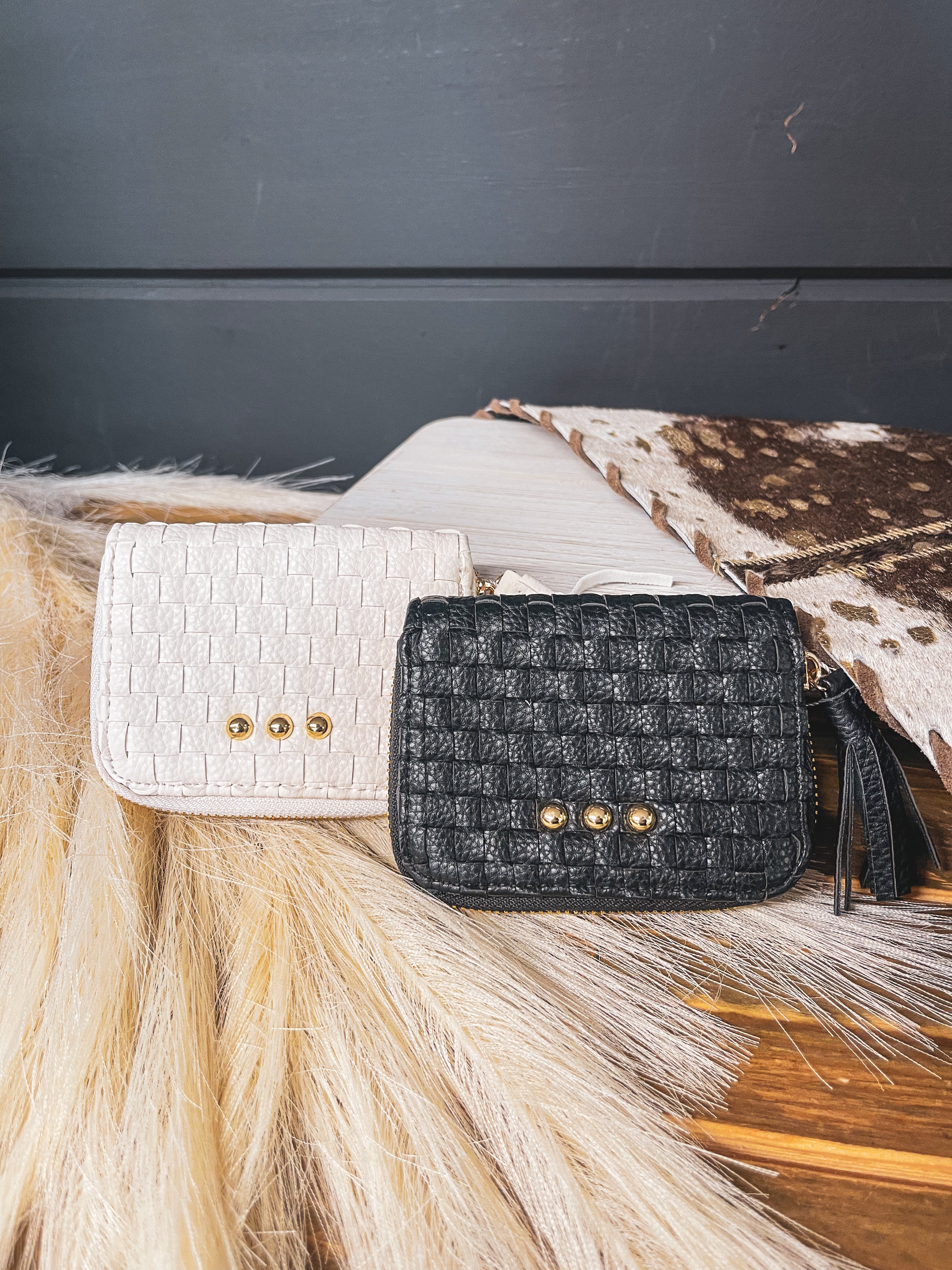 Small leather woven change purse, card holder, wallet in black or white with matching tassel and three gold balls on the front.