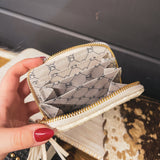 Small leather woven change purse, card holder, wallet in black or white with matching tassel and three gold balls on the front.