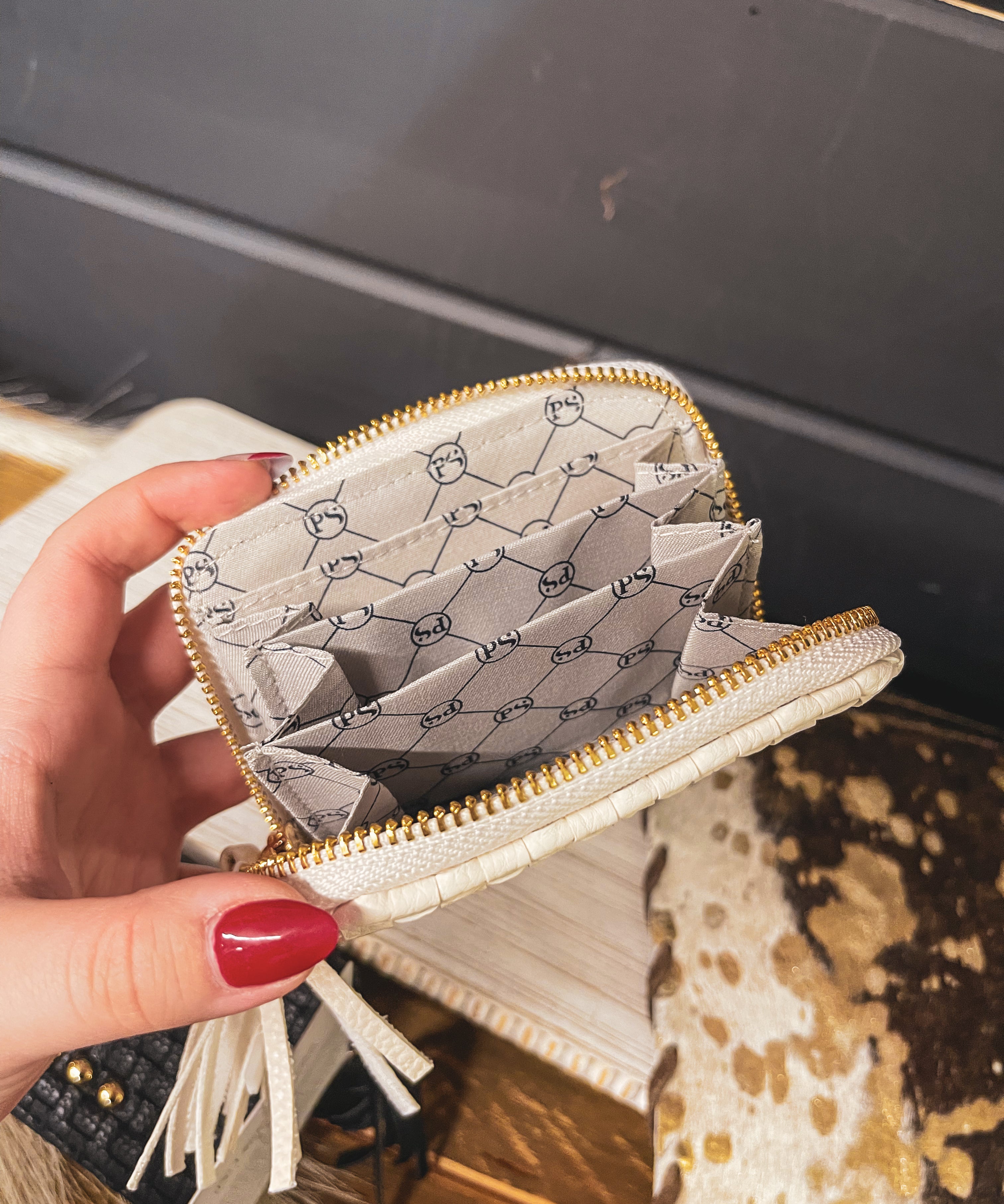 Small leather woven change purse, card holder, wallet in black or white with matching tassel and three gold balls on the front.