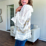 Soft, feminine and fun, this cream mixed textured pullover is your new go-to for effortless boho vibes. Lace details play beautifully with muted yellow and purple floral inserts, while 3/4 wide sleeves and matching rope drawstrings add that perfect playful touch. The relaxed, oversized fit? Perfect.