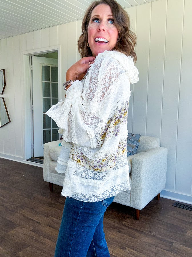 Soft, feminine and fun, this cream mixed textured pullover is your new go-to for effortless boho vibes. Lace details play beautifully with muted yellow and purple floral inserts, while 3/4 wide sleeves and matching rope drawstrings add that perfect playful touch. The relaxed, oversized fit? Perfect.