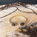 Authentic sterling silver balls surround a genuine Tiger's Eye oval on each end of this adjustable cuff with a sterling silver band.