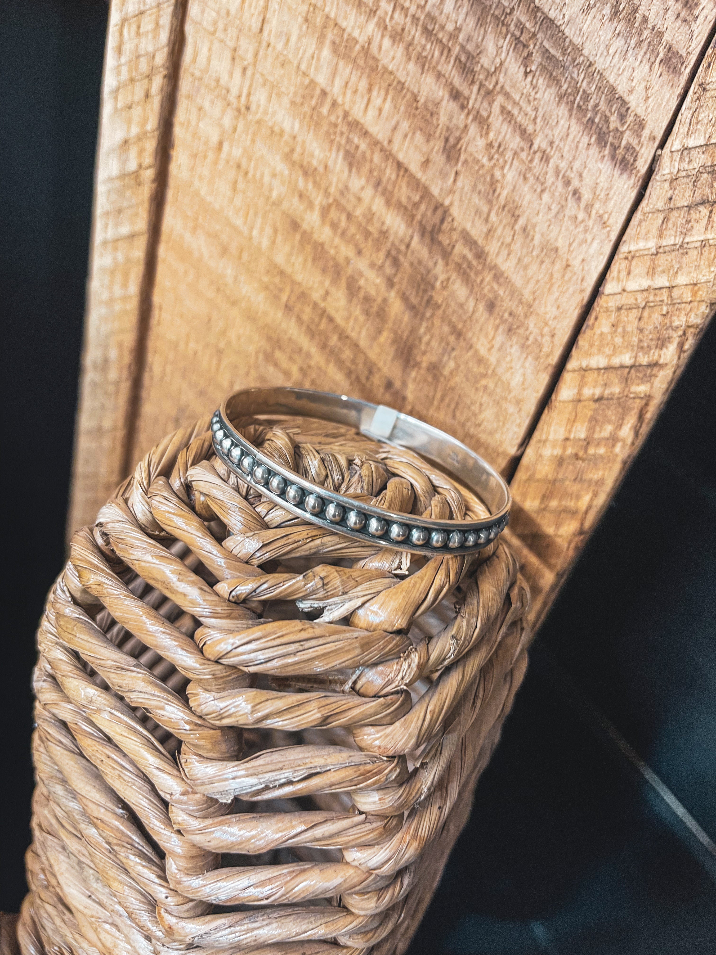Authentic Sterling Silver bangle featuring silver balls on an oxidized background.