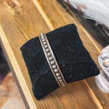 Authentic Sterling Silver bangle featuring silver balls on an oxidized background.