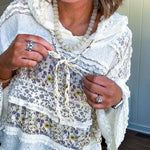 Soft, feminine and fun, this cream mixed textured pullover is your new go-to for effortless boho vibes. Lace details play beautifully with muted yellow and purple floral inserts, while 3/4 wide sleeves and matching rope drawstrings add that perfect playful touch. The relaxed, oversized fit? Perfect.