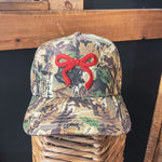 Canvas structured trucker hat with puff embroidery in various styles and coordinating bills.