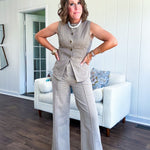  This mocha button-down denim vest is your new styling secret—pair it solo with our matching wide-leg pants for effortless sophistication, or throw it over a mesh tee and your go-to denim for that perfectly curated vibe. The antique bronze buttons and faux front pockets add just enough edge to keep things interesting, while the soft cotton-blend fabric moves with you. True to size, minimal stretch, maximum impact.